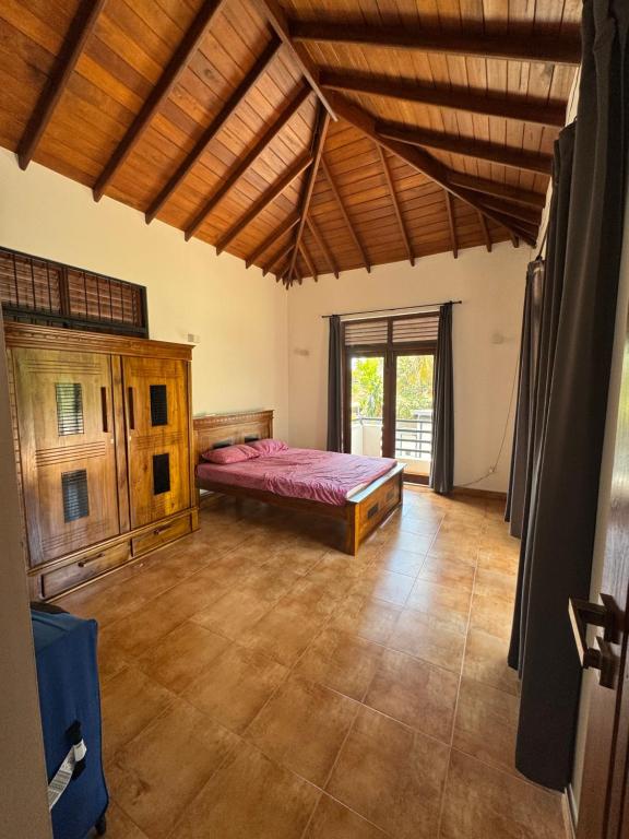 a bedroom with a bed in a room at PereraTree in Ja-Ela