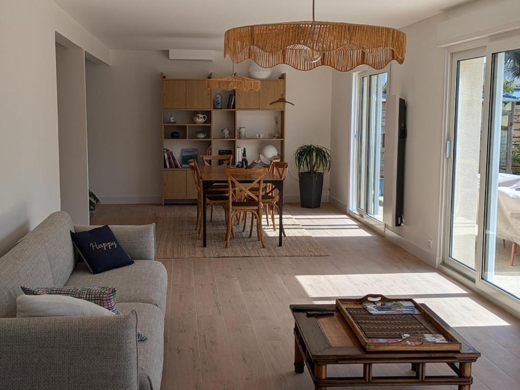 a living room with a couch and a table at La p'tite marquise in Roscoff