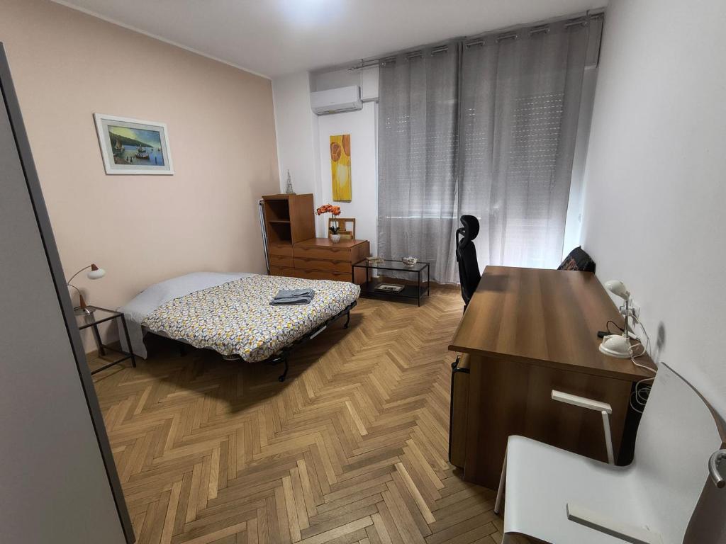 Postel nebo postele na pokoji v ubytování Bagaini Urban Flat