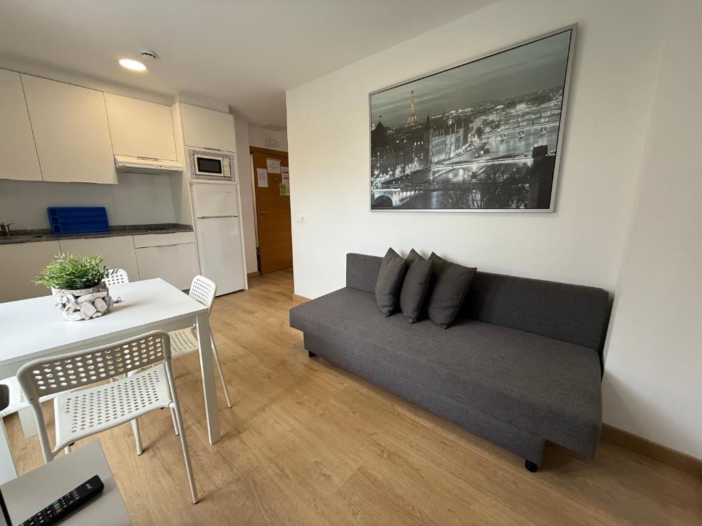 a living room with a couch and a table at SX50 Vut in Lugo