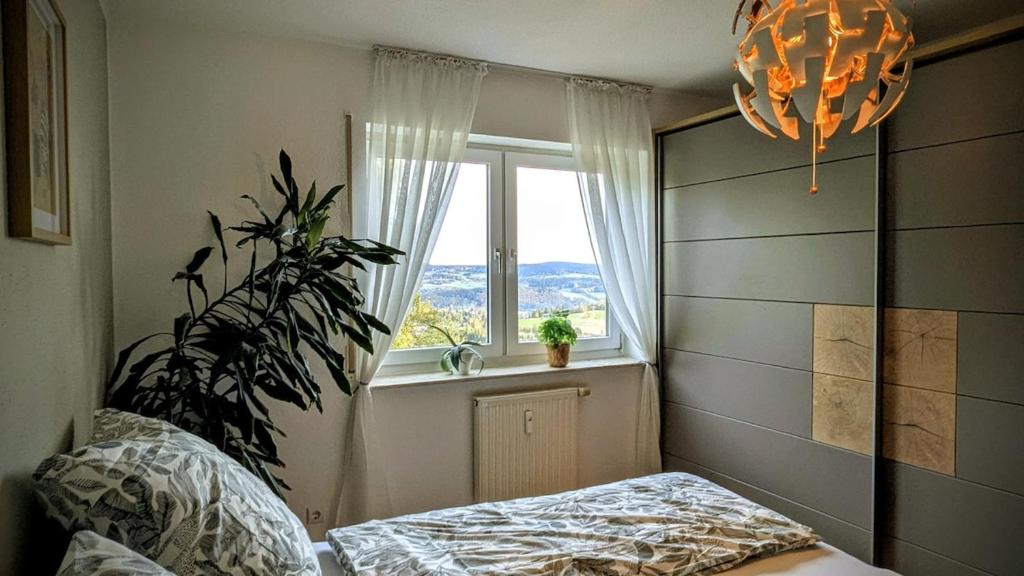 Ένα ή περισσότερα κρεβάτια σε δωμάτιο στο Weltenbummler Lodge in Schwarzenberg