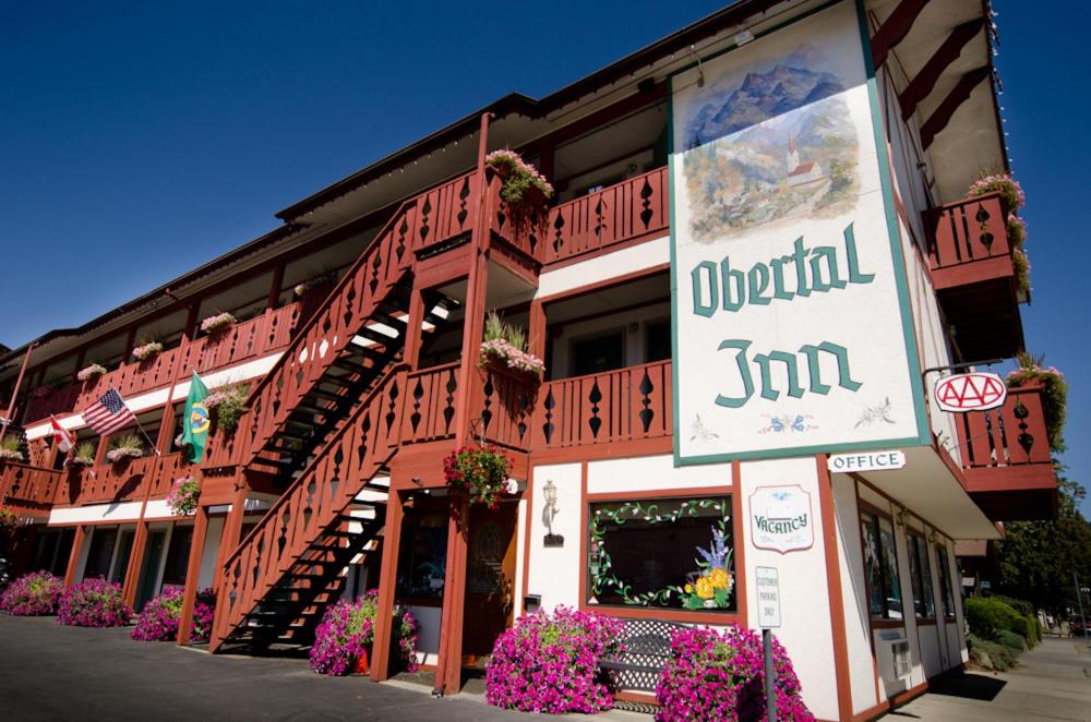 a restaurant with a sign on the front of a building at Obertal Inn in Leavenworth