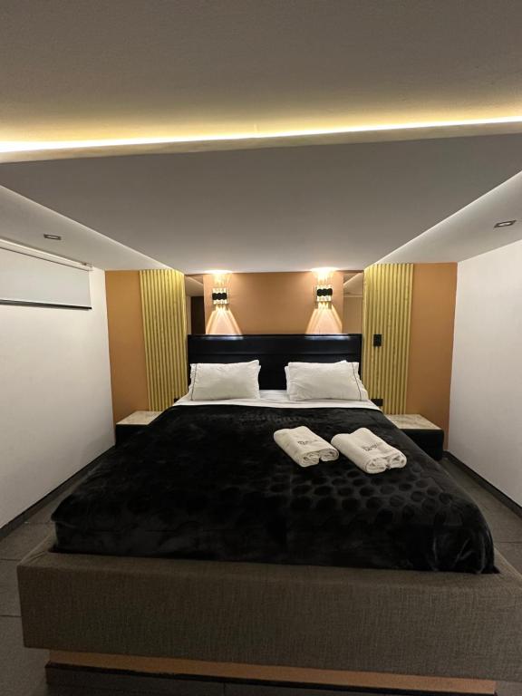 Postel nebo postele na pokoji v ubytování Hotel Biba Life - Chia