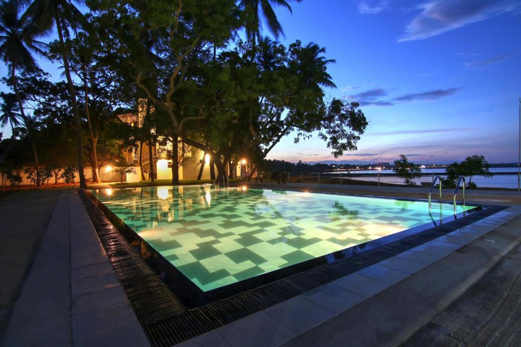 a large pool with a checkerboard pattern on it at Jade Green Hambantota in Hambantota