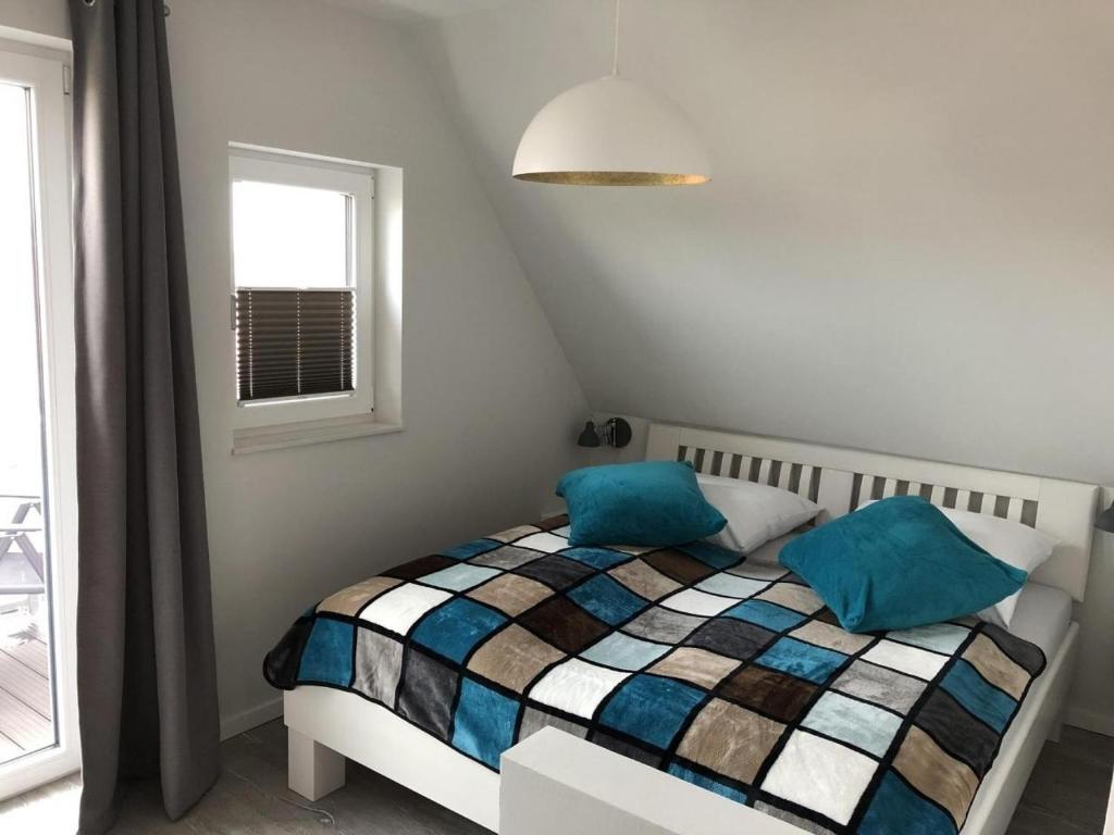 Postel nebo postele na pokoji v ubytování Westhook Appartement 3