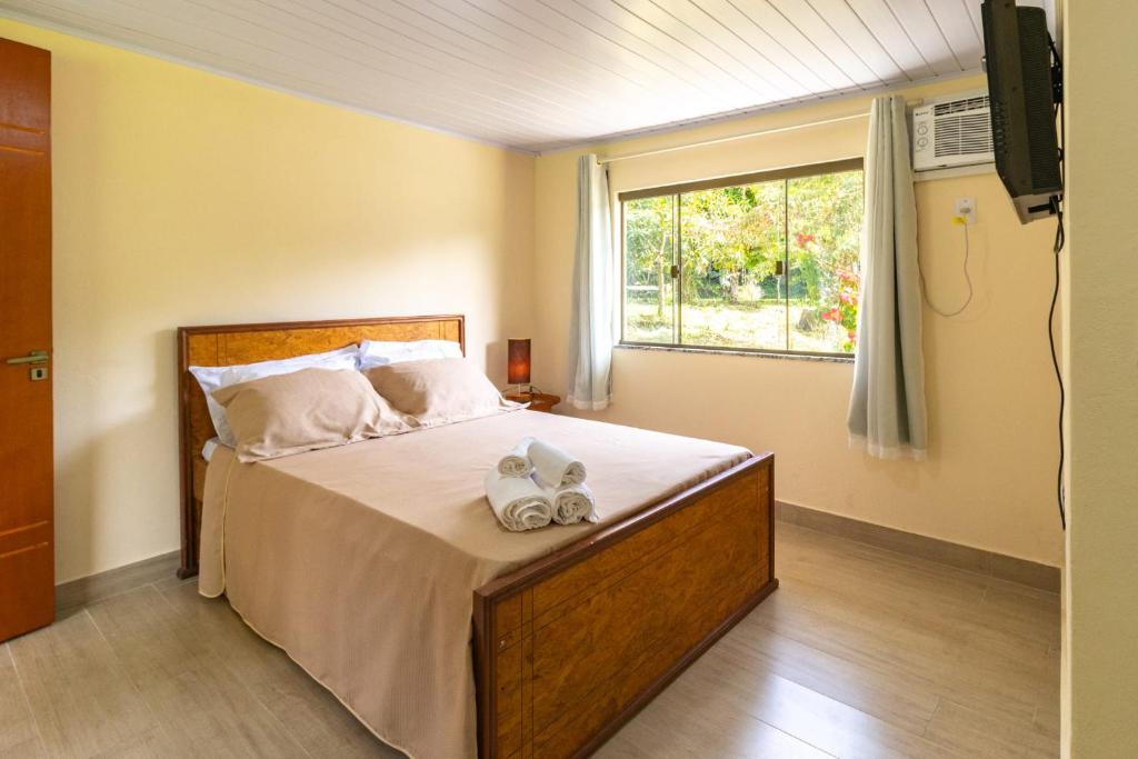 Postel nebo postele na pokoji v ubytování recanto mineiro