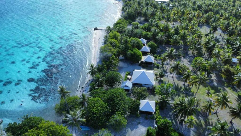 an aerial view of a resort on the beach at Monita Villa Rangiroa in Tiputa