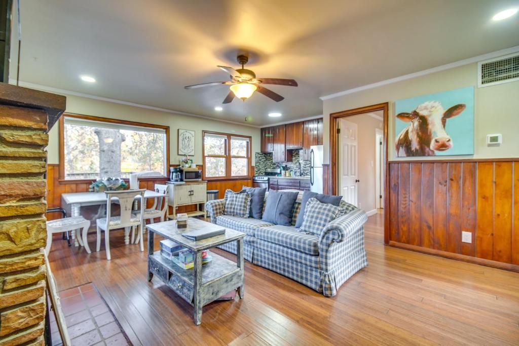 a living room with a couch and a table at Lakefront Eucha Escape with Views and Boat Slip! in Eucha