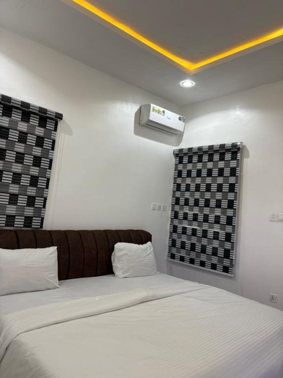 Кровать или кровати в номере Hideout, Wuye