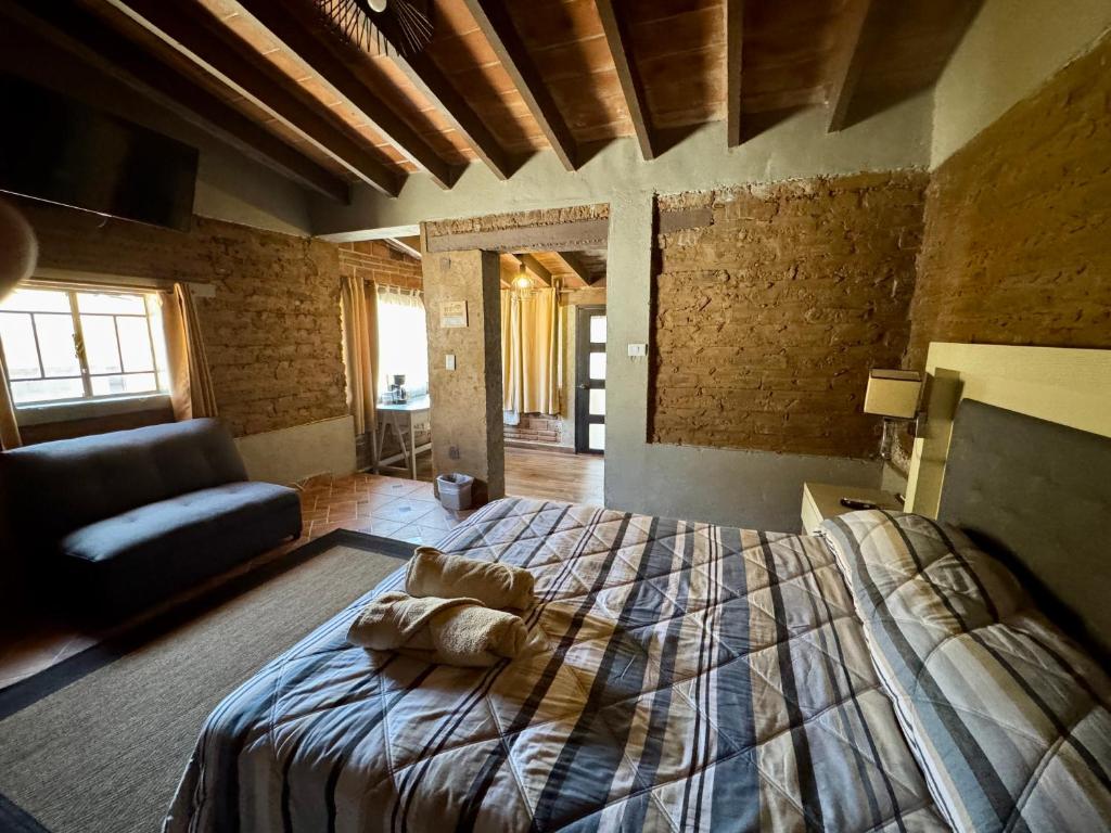 Ένα ή περισσότερα κρεβάτια σε δωμάτιο στο Cabañita TEPOZTLÁN