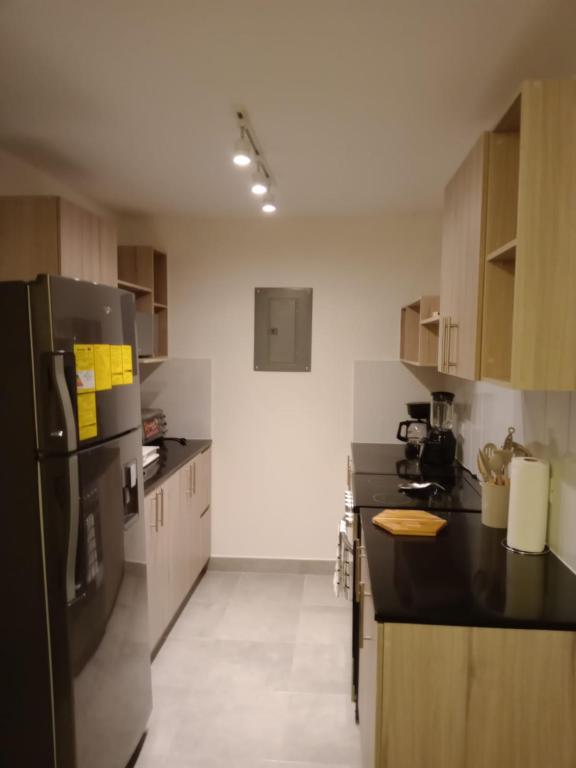 Kuchyň nebo kuchyňský kout v ubytování Vista 18 zona 10 parqueo y lavandería 4 personas