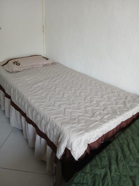 Ένα ή περισσότερα κρεβάτια σε δωμάτιο στο Cantinho da Praia