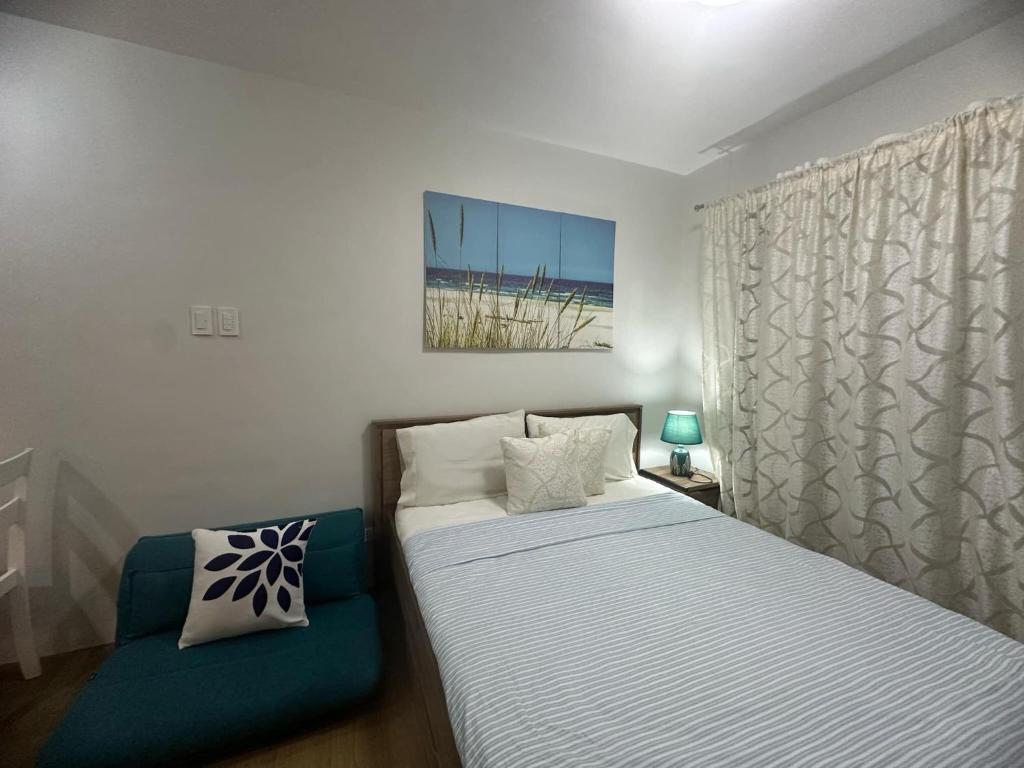 Ένα ή περισσότερα κρεβάτια σε δωμάτιο στο Tagaytay Idyllic Unwind Spot Retreat Near Foodie Area