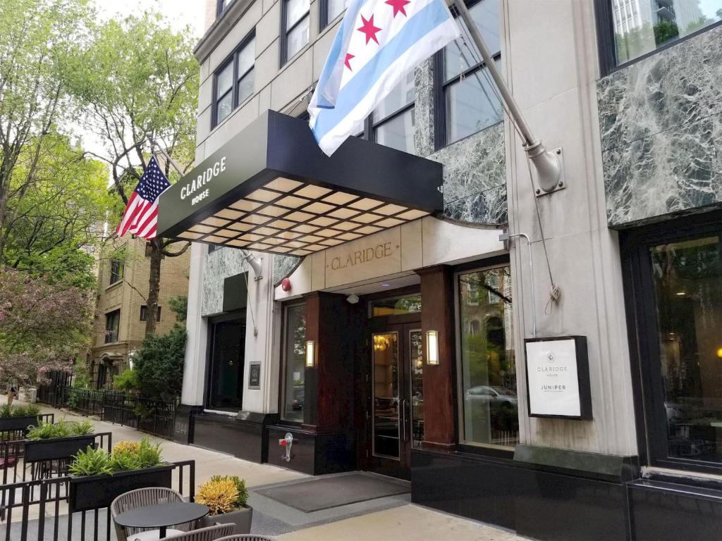 a building with an american and canadian flag at Claridge House Chicago, Tapestry Collection by Hilton in Chicago