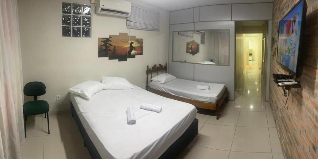 Ένα ή περισσότερα κρεβάτια σε δωμάτιο στο Los Hermanos