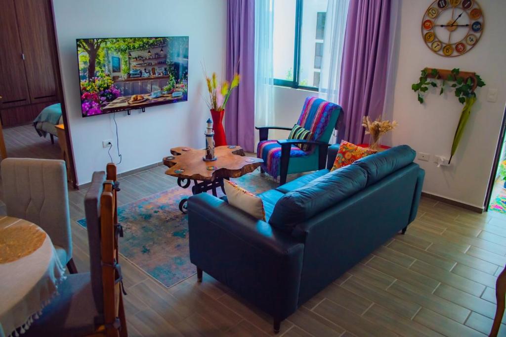 a living room with a couch and a table at Full Kitchen, Great View, Historic Center, Quiet in Puebla