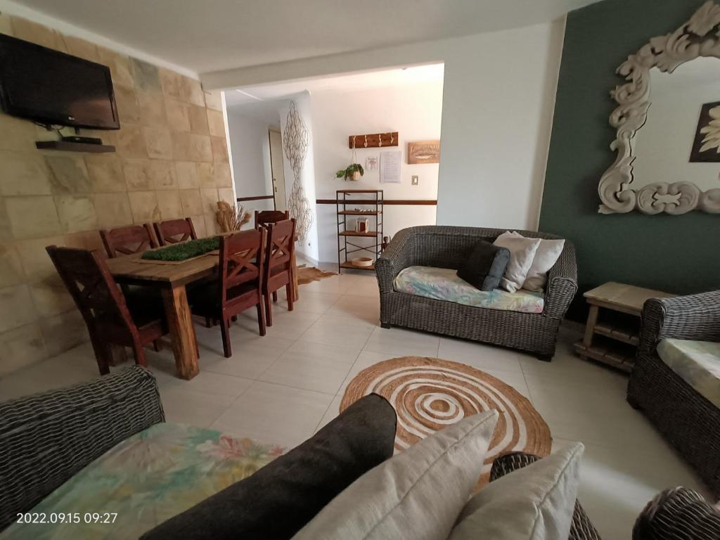 a living room with a couch and a table at DaaiPlek Holiday home in Richards Bay