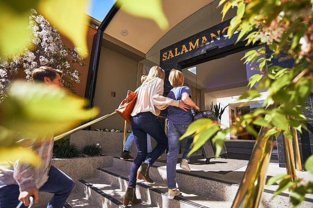 two women walking up the stairs of a store at Salamanca Inn in Hobart