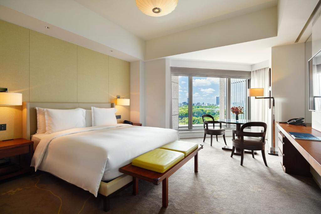 Postel nebo postele na pokoji v ubytování Palace Hotel Tokyo