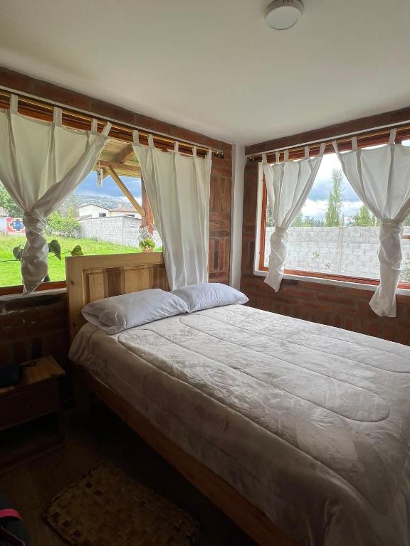 Postel nebo postele na pokoji v ubytování Amaya Wasi