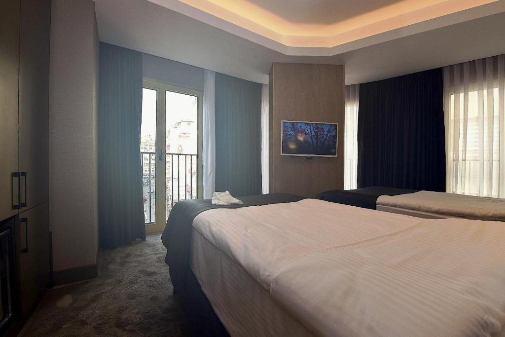 Postel nebo postele na pokoji v ubytování Mery Hotel İstanbul