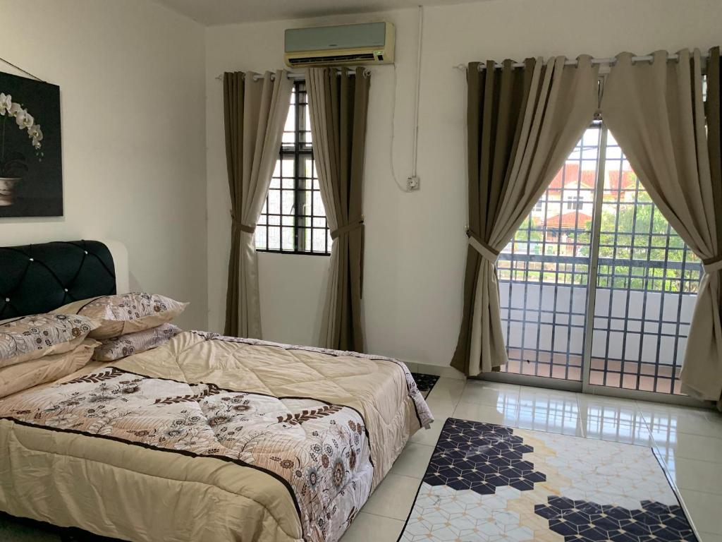 Postel nebo postele na pokoji v ubytování F'Seven Homestay