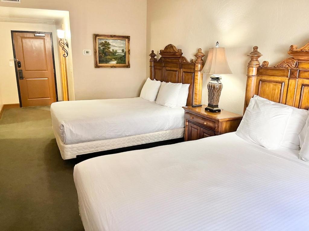 a hotel room with two beds and a lamp at Cozy Double Queen Mountain Suite Near Park City & Sundance Ski Resorts - 2047 in Mound City