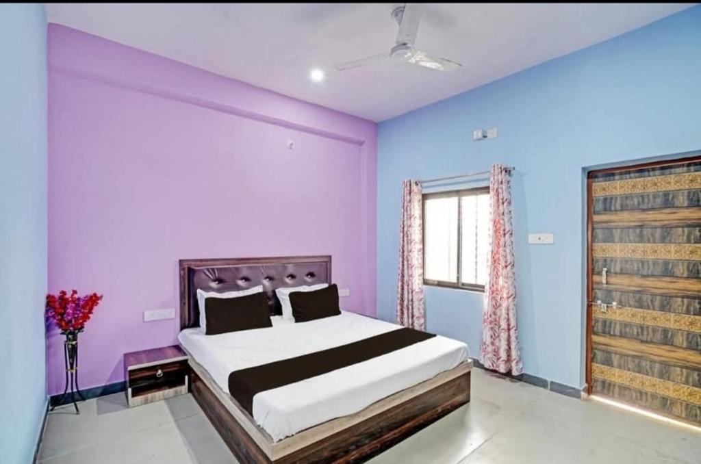 Ένα ή περισσότερα κρεβάτια σε δωμάτιο στο Harsh Garden