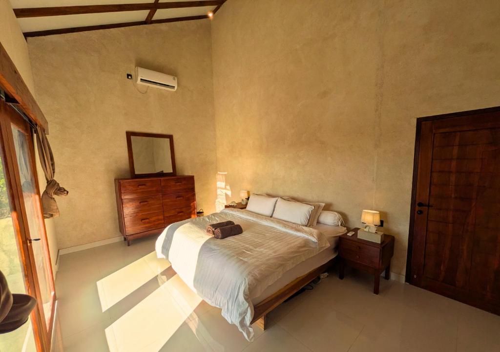 Postel nebo postele na pokoji v ubytování Koe Koe Villa