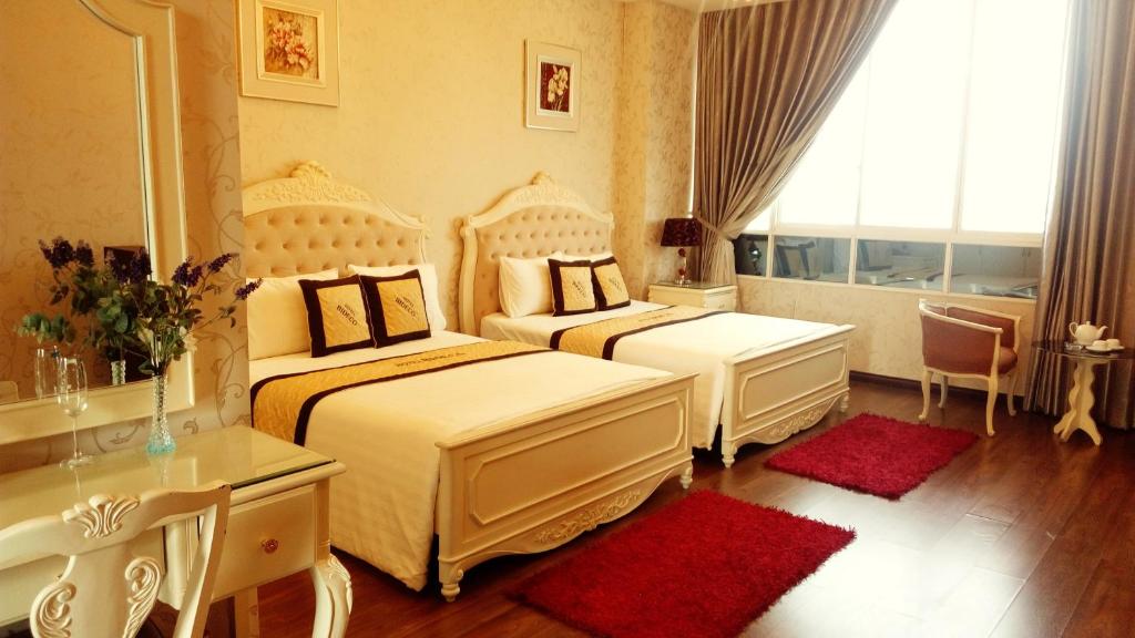 Postel nebo postele na pokoji v ubytování Bideco Hotel