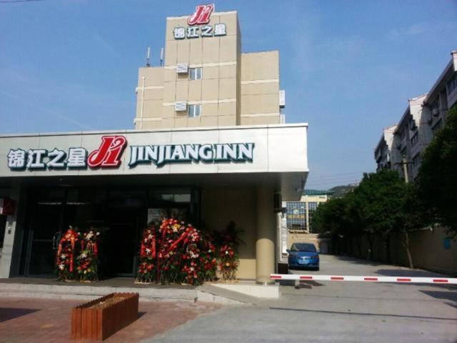 a building with a sign on the front of it at Jinjiang Inn Jinan Jingshi Road Qianfo Mountain in Jinan