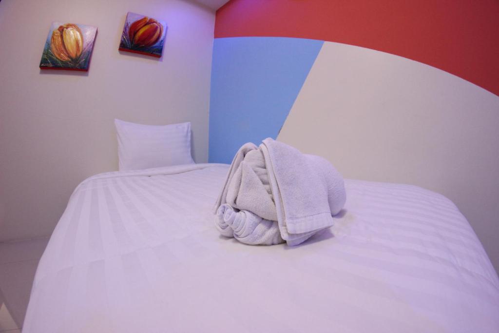Postel nebo postele na pokoji v ubytování Tulip Inn