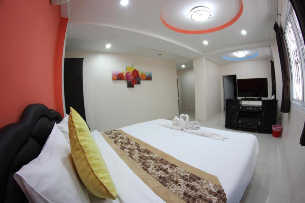 Postel nebo postele na pokoji v ubytování Tulip Inn