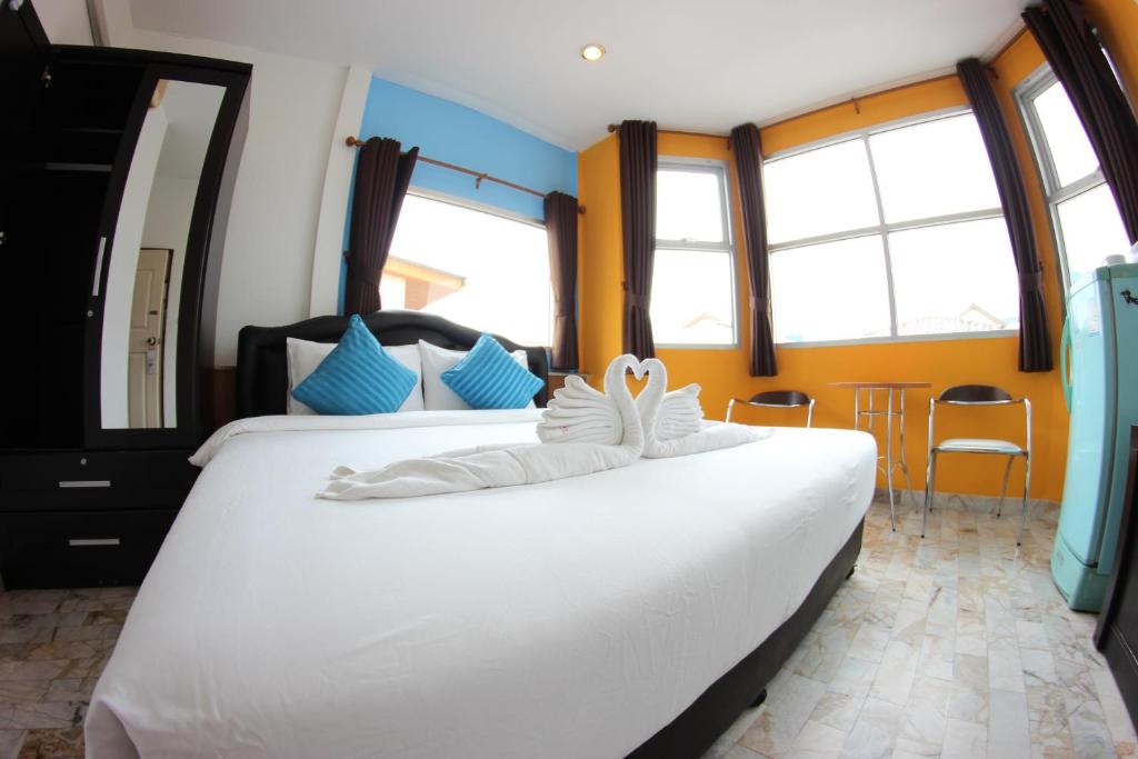 Postel nebo postele na pokoji v ubytování Tulip Inn