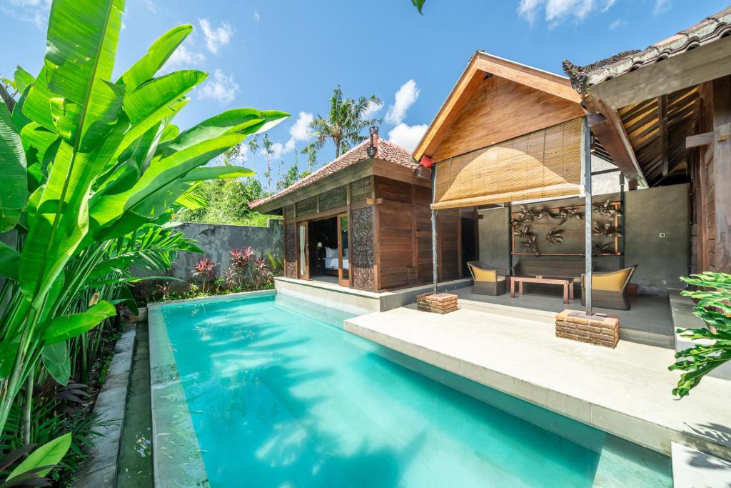 an image of a villa with a swimming pool at Villa Sage Bali in Darmasaba