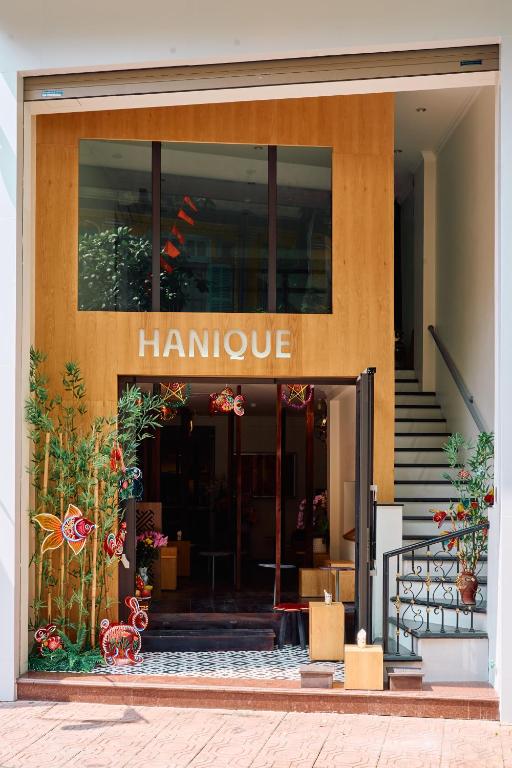 a building with the entrance to a harmaarmaarmaarmaastery at Hanique Cafe and Stay in Hanoi