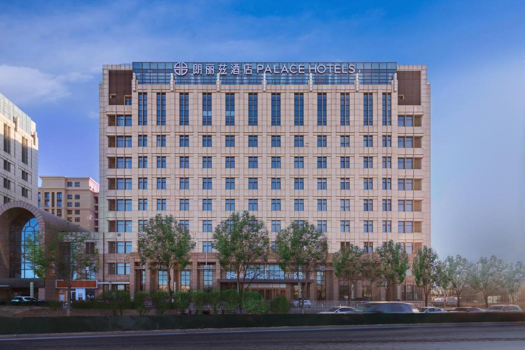 a building with a sign on the top of it at Langliz Hotel Capital Airport New International Exhibition Center Branch in Beijing