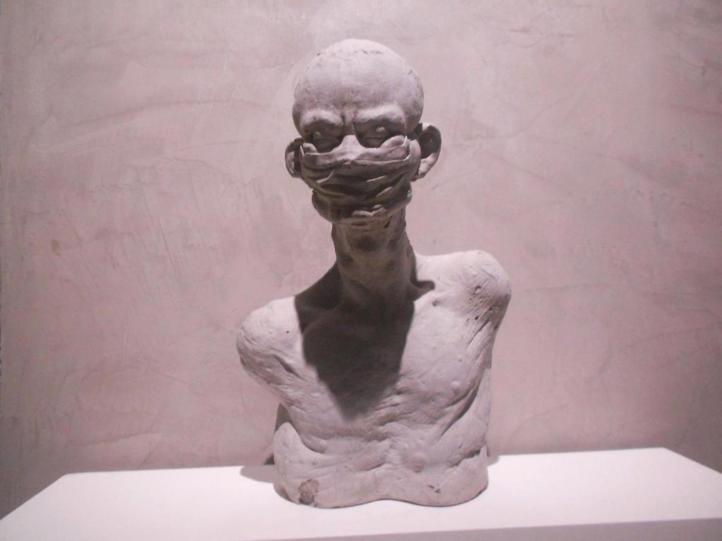 a statue of a woman with her hand over her face at Orchid Bloom Suite-City Heart-Near Street Food & Coffee 24-7 in Hanoi