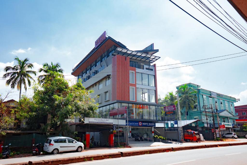a red and white building on a city street at celestia by thoppil in Kottakkal