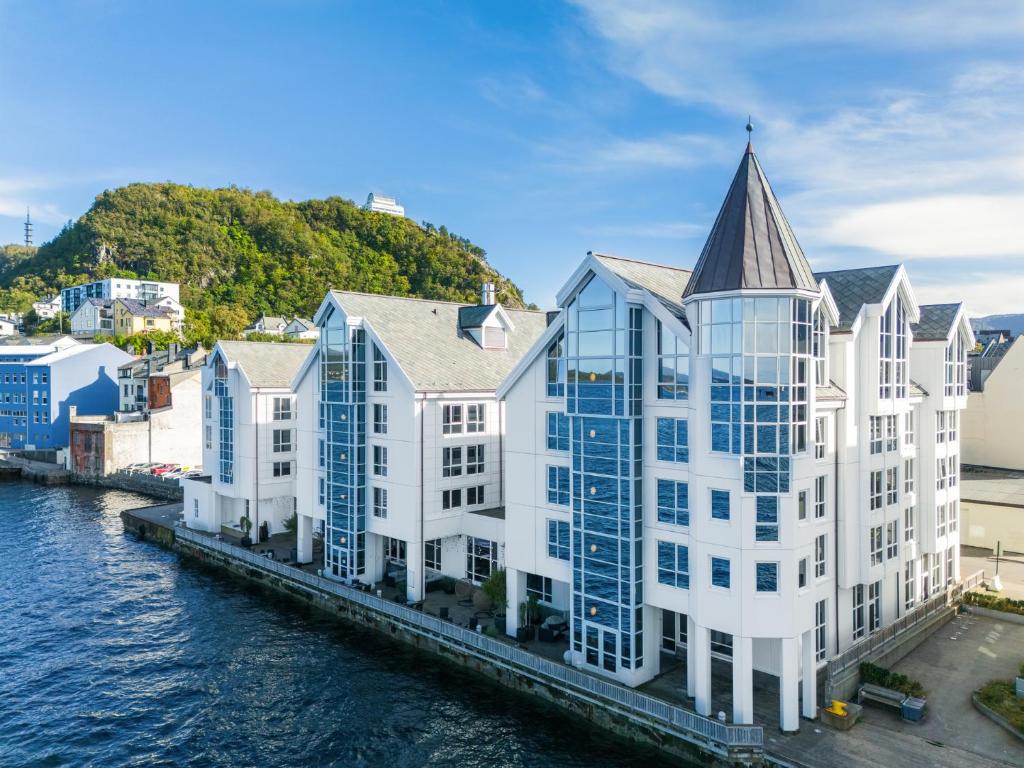 an aerial view of a white building next to the water at Quality Hotel Ålesund in Ålesund
