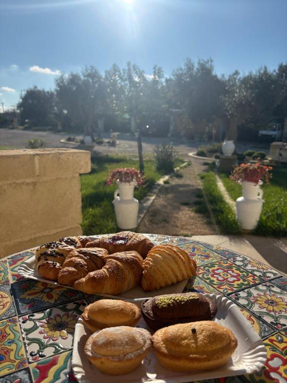 a table topped with pastries on top of a table at Masseria Causio in Giurdignano