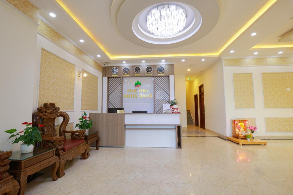 a lobby with a reception desk in a building at Khách sạn Pine Hill Hotel Dalat in Da Lat