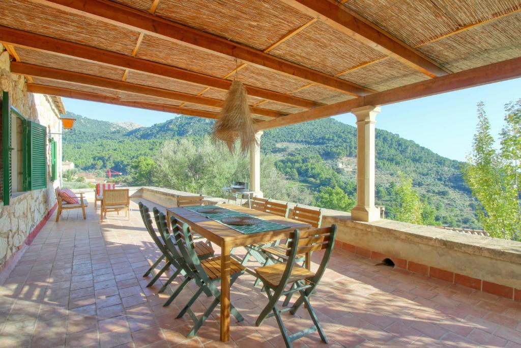 a table and chairs on a patio with a view at Best Views in Valldemossa in Valldemossa