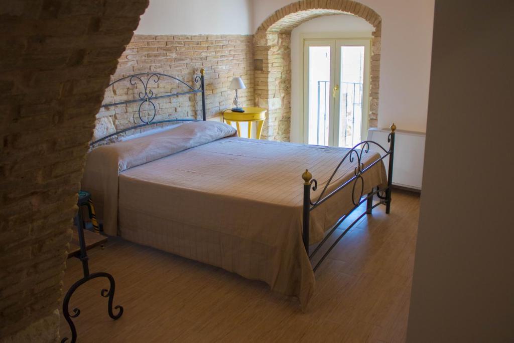 Postel nebo postele na pokoji v ubytování Residenza delle Grazie