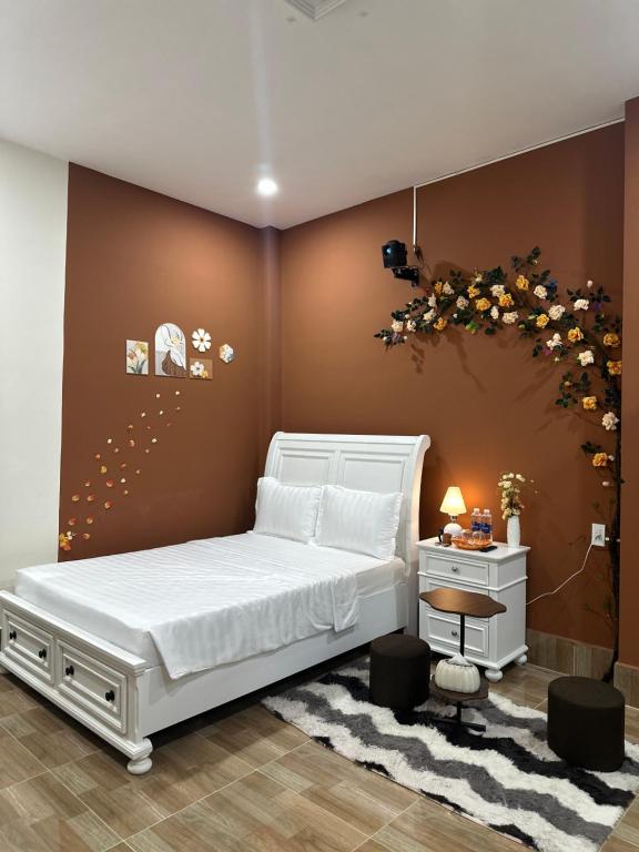 Ένα ή περισσότερα κρεβάτια σε δωμάτιο στο Nhà nghỉ Candy's House - Cần Thơ