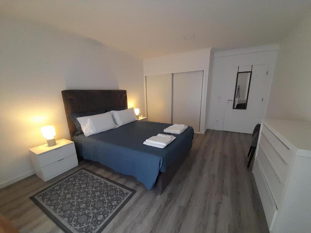 Postel nebo postele na pokoji v ubytování Windmill Açores Suite