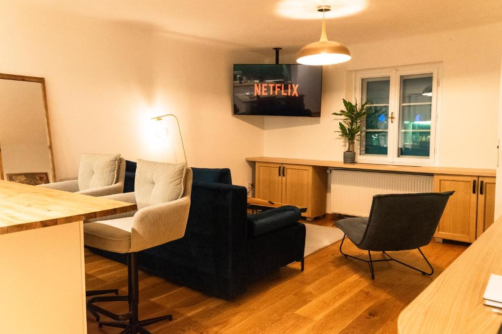 a living room with two chairs and a table at Castelului Boutique-Old Town-Free Private Parking in Braşov