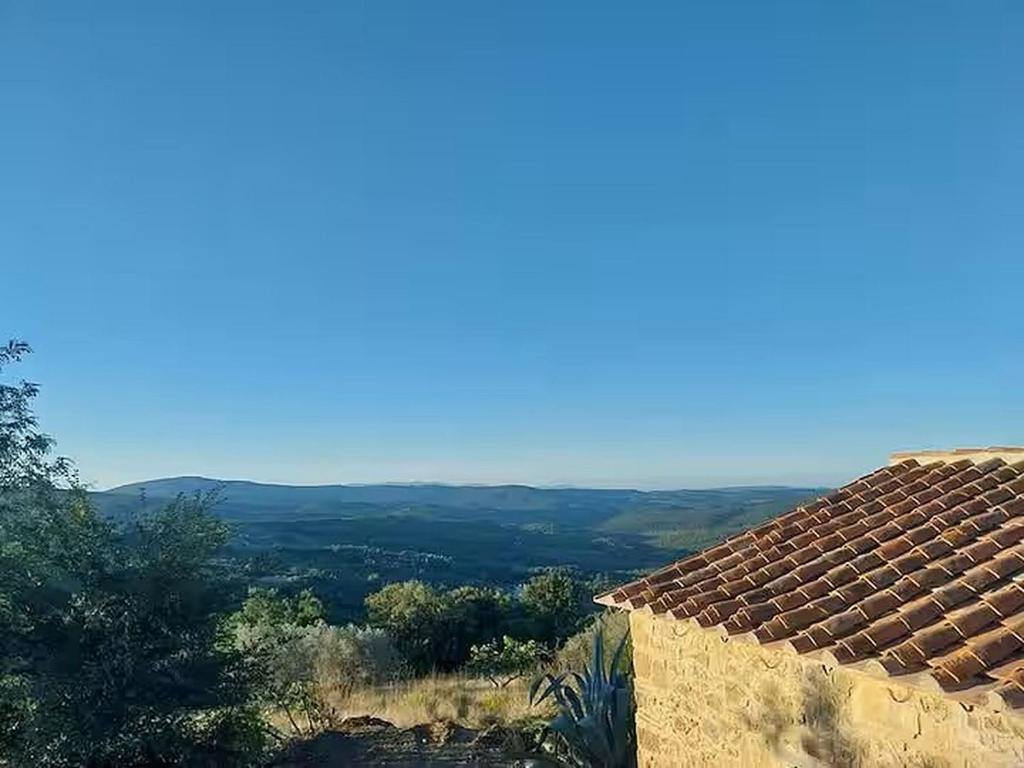 a view of a roof of a house with a view at Cottage in pietra indipendente con parco privato Polvere di Stelle in Monterotondo