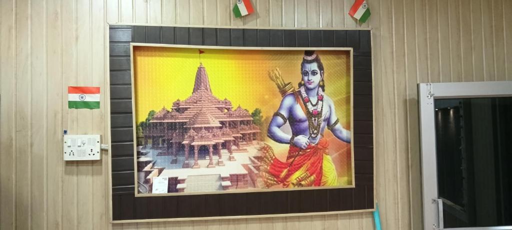 a painting of a deity on a wall at Shri omkarnath Guest house Ayodhya in Ayodhya