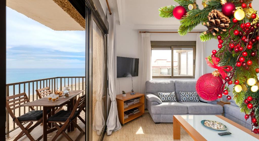 a living room with a christmas tree and a couch at Beach Haven by Fidalsa in El Moncayo
